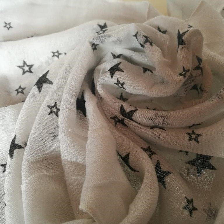 white, cotton-polyester blend scarf, with black star design